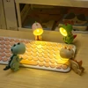 Kép 12/14 - Mini aranyos dinoszaurusz LED-es asztali lámpa állítható szöggel, gyerekszobába - Kék