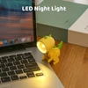 Kép 13/14 - Mini aranyos dinoszaurusz LED-es asztali lámpa állítható szöggel, gyerekszobába - Kék