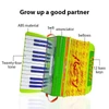 Kép 7/11 - Mini 24 gombos 12 basszus harmonika ABS anyag csattal, hangszer kezdőknek - Zöld